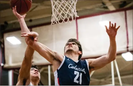  ?? JAMES BEAVER — FOR MEDIANEWS GROUP ?? Plymouth Whitemarsh’s Luke DiCianno (21) is fouled by Abington’s Caleb Baker (13) on his way to the net.