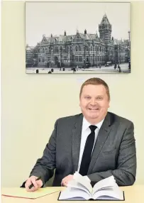  ?? PHOTO: PETER MCINTOSH ?? A year on . . . Dunedin coroner David Robinson at his office in the Dunedin District Court.