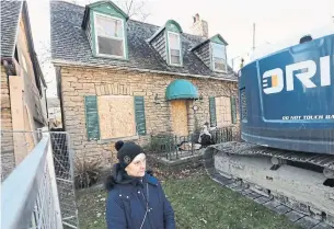  ?? RICHARD LAUTENS TORONTO STAR ?? Charlotte Sheasby-Coleman was so upset by plans to knock down a historic home in her Mimico neighbourh­ood that she arrived at the house at 7 a.m. and sat on the front step.