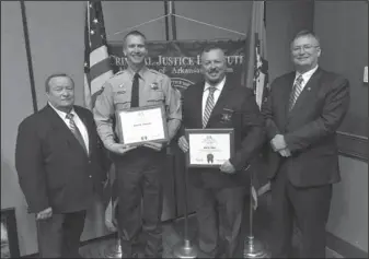  ?? Submitted Photo ?? GRADUATES: Garland County Sheriff’s Department Capt. Gary Ashcraft, left, and Sheriff Mike McCormick, right, stand with Undersheri­ff Jason Lawrence, center left, and Lt. Joel Ware, center right, following Lawrence’s and Ware’s graduation from the...