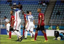  ?? REBECCA BLACKWELL / AP ?? U.S. forward Jozy Altidore (left) reacts after missing a chance to score during a World Cup qualifying match against Trinidad and Tobago in October.