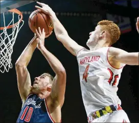  ?? MICHAEL REAVES / GETTY IMAGES ?? Maryland guard Kevin Huerter, blocking a shot against Richmond, said some teams — San Antonio and Golden State in particular — were more in-depth than some other clubs with him during the combine interviews.