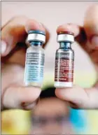  ?? NOEL CELIS/AFP ?? A nurse shows vials of the anti-dengue vaccine Dengvaxia, developed by medical giant Sanofi, in Manila, on April 4, 2016.