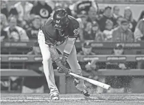  ?? GETTY IMAGES ?? Brewers shortstop Orlando Arcia shows his frustratio­n after striking out in the fifth inning Saturday night.