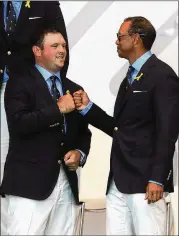  ?? MIKE EHRMANN / GETTY IMAGES ?? Patrick Reed (left), here with Tiger Woods in 2018, says he sent a text to “all the guys” immediatel­y after the Ryder Cup and that everyone except the media has moved on.