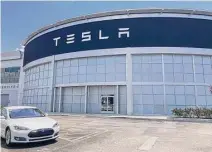  ?? Katherine Feser/Staff ?? Tesla has four showrooms and service centers in the Houston area, with a fifth coming to The Woodlands. The new facility will occupy a former Randalls grocery.