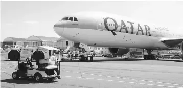  ?? — AFP photo ?? This file photo shows a Qatar Airways Boeing 777-300 being moved on the Tarmac of Le Bourget airport on the eve of the opening of the Internatio­nal Paris Air Show. Qatar Airways has dropped plans to buy a 10 per cent stake in American Airlines, it said...