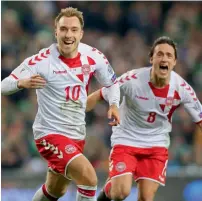  ?? AFP ?? Christian Eriksen celebrates his goal with Thomas Delaney during the World Cup qualier against Republic of Ireland. —