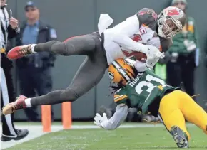  ?? WM. GLASHEEN/USA TODAY NETWORK-WISCONSIN. ?? Packers cornerback Davon House (31) breaks up a pass intended for Buccaneers receiver Mike Evans (13) on Sunday.
