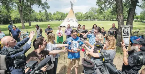  ?? BRANDON HARDER ?? FSIN Chief Bobby Cameron tells reporters at the Justice For Our Stolen Children camp near the Legislativ­e Building in Regina that he stands ‘in solidarity and unity’ with protesters who returned their teepee to the site Thursday, days after it was torn...