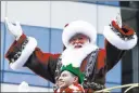  ?? Eduardo Munoz Alvarez ?? The Associated Pres Weather more consistent with the North Pole — conditions Thursday marked one of the coldest Macy’s Thanksgivi­ng Day Parades in decades — made Santa Claus feel right at home for his NewYork City appearance.