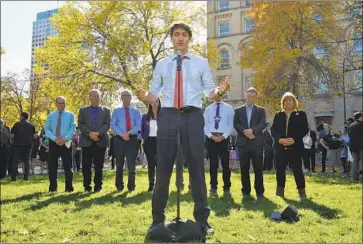  ?? Sean Kilpatrick Canadian Press ?? PRIME MINISTER Justin Trudeau speaks to the media in Winnipeg. With elections a month away, he apologized and begged Canadians for forgivenes­s after images of him in racially offensive makeup emerged.