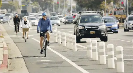  ?? Al Seib Los Angeles Times ?? LOS ANGELES is among the U.S. cities that have tried to green their streets by expanding public transporta­tion and bicycle lanes.