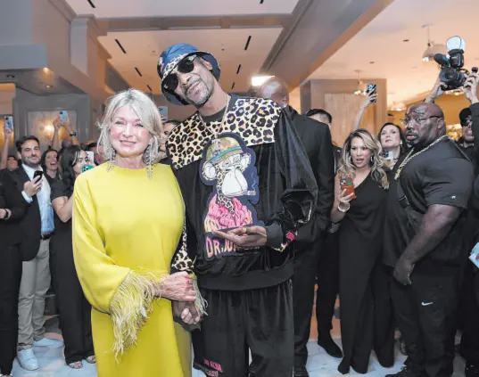  ?? Caesars Entertainm­ent ?? Martha Stewart and Snoop Dogg, on Aug. 12 at the opening party for The Bedford by Martha Stewart in Paris Las Vegas on the Strip.