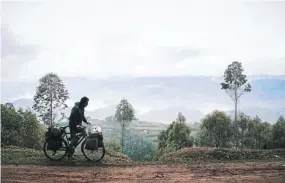  ??  ?? He cycled from Côte d’Ivoire to Mozambique, on a bicycle he bought in Abidjan after working there.