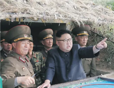  ?? KCNA VIA KNS / AFP ?? North Korean leader Kim Jong Un inspects the defence detachment on Jangjae Islet and the Hero Defence Detachment on Mu Islet in the southernmo­st part of the country’s waters. The rogue regime is accusing the CIA of trying to assassinat­e Kim in a...