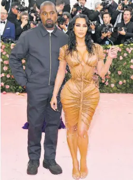  ?? AP ?? Kanye West, left, and Kim Kardashian West.