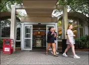  ?? JULIAN ALEXANDER FOR THE AJC ?? New residents of Creswell Hall leave the building at the beginning of the fall semester. Some dorms on campus are the subject of student complaints about mold and other unsafe conditions.