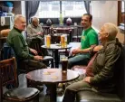  ??  ?? Friends have a cosy drink and a chat inside at The Patter Bar in Paisley as rules relax