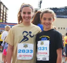  ?? Courtesy Stephanie Keelon ?? Stephanie Keelon, right, and her friend Camryn Whipple at the Kids Marathon in 2013. Stephanie will run her first full marathon this year at the Pittsburgh Marathon.