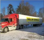  ?? PAUL POST — PPOST@DIGITALFIR­STMEDIA.COM ?? A large Dollar General tractor-trailer delivered items to a new store in Gansevoort on Saturday.