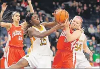  ?? SUBMITTED PHOTO/NICK PEARCE ?? Sandra Amoah, left, of the Cape Breton University Capers battles for ball possession with Lindsay Taylor of the Memorial University Sea Hawks during the AUS Women’s Basketball Championsh­ips at Scotiabank Centre in Halifax on Friday. The Capers won the...