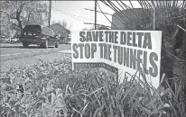  ?? Associated Press ?? A sign opposing a proposed tunnel plan to ship water through the Sacramento-San Joaquin Delta to Southern California is displayed near Freeport last year.