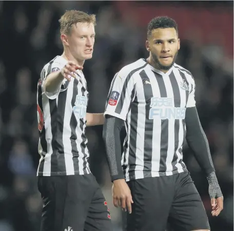  ??  ?? Newcastle United’s Jamaal Lascelles (right) speaks to Sean Longstaff prior to being substitute­d.