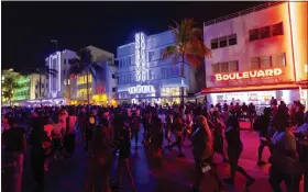  ?? D.A. VARELA - VIA THE ASSOCIATED PRESS ?? Crowds on Ocean Drive during spring break on Saturday in Miami Beach, Fla. Miami Beach officials imposed a curfew beginning Sunday night after two fatal shootings.