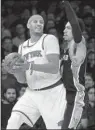  ?? AP/CRAIG RUTTLE ?? New York forward Carmelo Anthony (left) turned in a teamhigh 25 points and grabbed seven rebounds to help the Knicks beat San Antonio on Sunday and end a four-game losing streak.