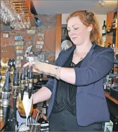  ??  ?? Ealana Boyle pulls a pint in the rebranded Crofters’. 01_B42crofter­s01