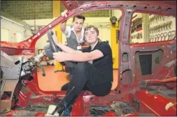  ??  ?? Kyle Wade and Jamie Burr in the hi-tech car workshop