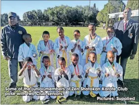  ?? Pictures: Supplied ?? Some of the junior members of Zen Shotokan Karate Club pose with two Club seniors.