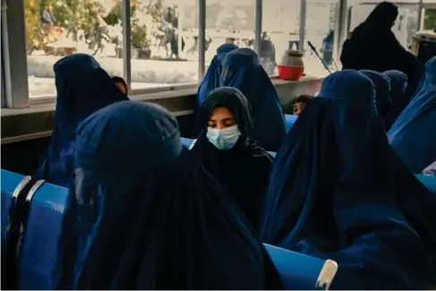  ?? (PhotosTheW­ashingtonP­ostbyEilse­Banclhard) ?? A girl and womens it in the waiting room of the paediatric outpatient department at the Maid an Shahr provincial hospital