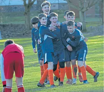  ??  ?? Fairmuir players celebrate a goal in their U/16 Queen’s Jubilee Cup semi-final win over Carnoustie Panmure at Graham Street.