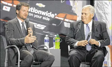  ?? CHUCK BURTON / ASSOCIATED PRESS ?? Dale Earnhardt Jr. (left) with team owner Rick Hendrick, who did not name a replacemen­t driver for Earnhardt’s No. 88 Chevrolet. Earnhardt told Hendrick on March 29 of his decision to retire.