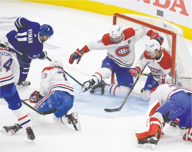  ?? DAN HAMILTON / USA TODAY SPORTS ?? Toronto Maple Leafs forward Zach Hyman scores against Montreal Canadiens in Game 5 of their NHL playoff series Thursday at Scotiabank Arena.