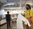  ?? MARK LENNIHAN ?? A woman shops for clothing in a Gap store during the coronaviru­s pandemic, Tuesday, June 30, 2020, in New York. New York City may begin Phase 3reopening as early as Monday, July 6.