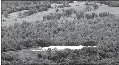  ?? Arkansas Democrat-Gazette/MITCHELL PE MASILUN ?? The C&H Hog Farms’ operation, shown May 4, sits near a Buffalo River tributary in Newton County.