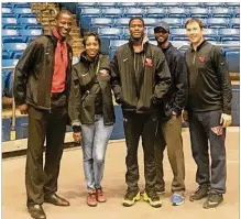  ?? CONTRIBUTE­D PHOTO ?? Jalen Crutcher (center) joins Anthony Grant (left) and assistant James Kane, along with parents Shelia (second from left) and Greg (second from right).