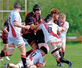  ?? Picture by Nigel Miller ?? Gordon League tacklers look to halt a Bream attack