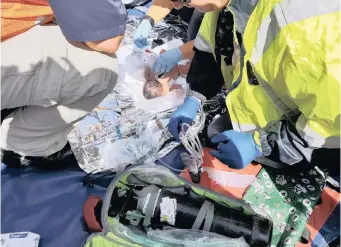  ??  ?? RESCUE teams consisting of Durban Fire and Rescue, emergency medical services as well as SAPS and metro police rescue a baby girl who had been dumped in a stormwater drain in Newlands East yesterday. | SE-ANNE RALL