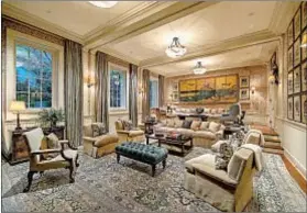  ??  ?? THERE ARE f ive bedrooms, 7.5 baths and more in 16,439 square feet designed by former White House decorator Michael Smith.