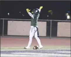  ?? MEGAN WIDICK/Special to the Valley Press ?? Palmdale’s Damario Jackson celebrates a touchdown against Santa Ana on Friday at Palmdale High. The Falcons won the quarterfin­al game 21-14 to advance to the semifinals.