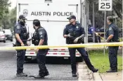  ?? MIKALA COMPTON / AUSTIN AMERICAN-STATESMAN ?? Police investigat­e after an officer died in a shooting in South Austin, Texas, on Saturday. A second officer was wounded Saturday and the the suspected gunman was also killed.