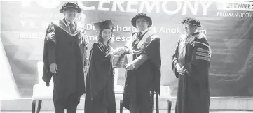  ??  ?? Best Student for Diploma in Human Resource Management, Roz Gyna Nuri Griffin receives her scroll from Jack as Tham (left) looks on.