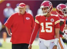  ?? Tammy Ljungblad / Kansas City Star ?? Chiefs coach Andy Reid rested QB Patrick Mahomes, front, and other stars for the regular-season finale after they clinched a first-round bye in Week 16.