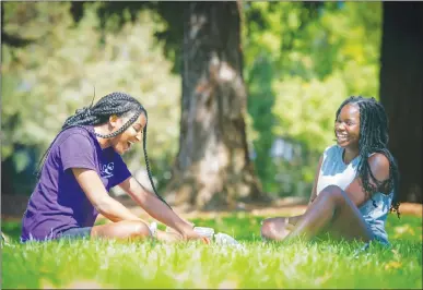  ?? Appeal-democrat ?? Zenobie Jones, left, and Shaynecia Van Doorn, both of Yuba City, have lunch at Hillcrest Park in Yuba City on Tuesday.