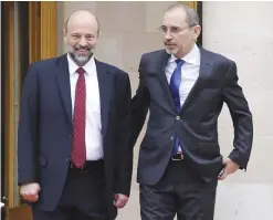  ??  ?? AMMAN: Jordan’s newly appointed Foreign Minister Ayman Safadi, right, and newly appointed Education Minister Omar Ahmad Munif Al Razzaz speak together upon their appointmen­t following a meeting at the Jordanian Royal Palace in Amman yesterday. —AP