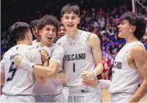  ?? CHANCEY BUSH/JOURNAL ?? Volcano Vista celebrates after winning its second straight 5A state title on Saturday night at the Pit. Down by three heading into the fourth, the Hawks closed on a 21-6 run to lock up the victory.